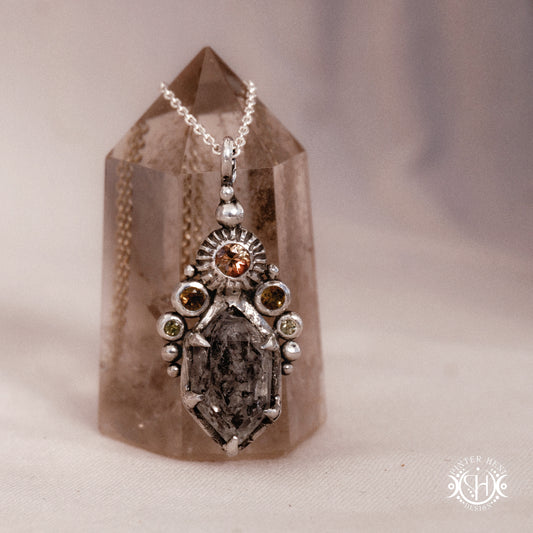 One of a kind sterling silver Desert Rites pendant with raw Herkimer diamond, tourmaline and green sapphire