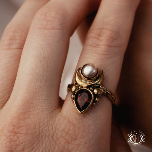 Handmade small scale Hecate ring with aquamarine in sculptural feminine design,worn on hand.