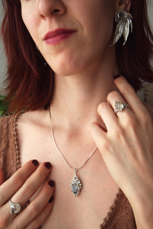 One-of-a-kind sterling silver ring featuring a raw Herkimer diamond. Organic sculptural design with natural crystal texture.