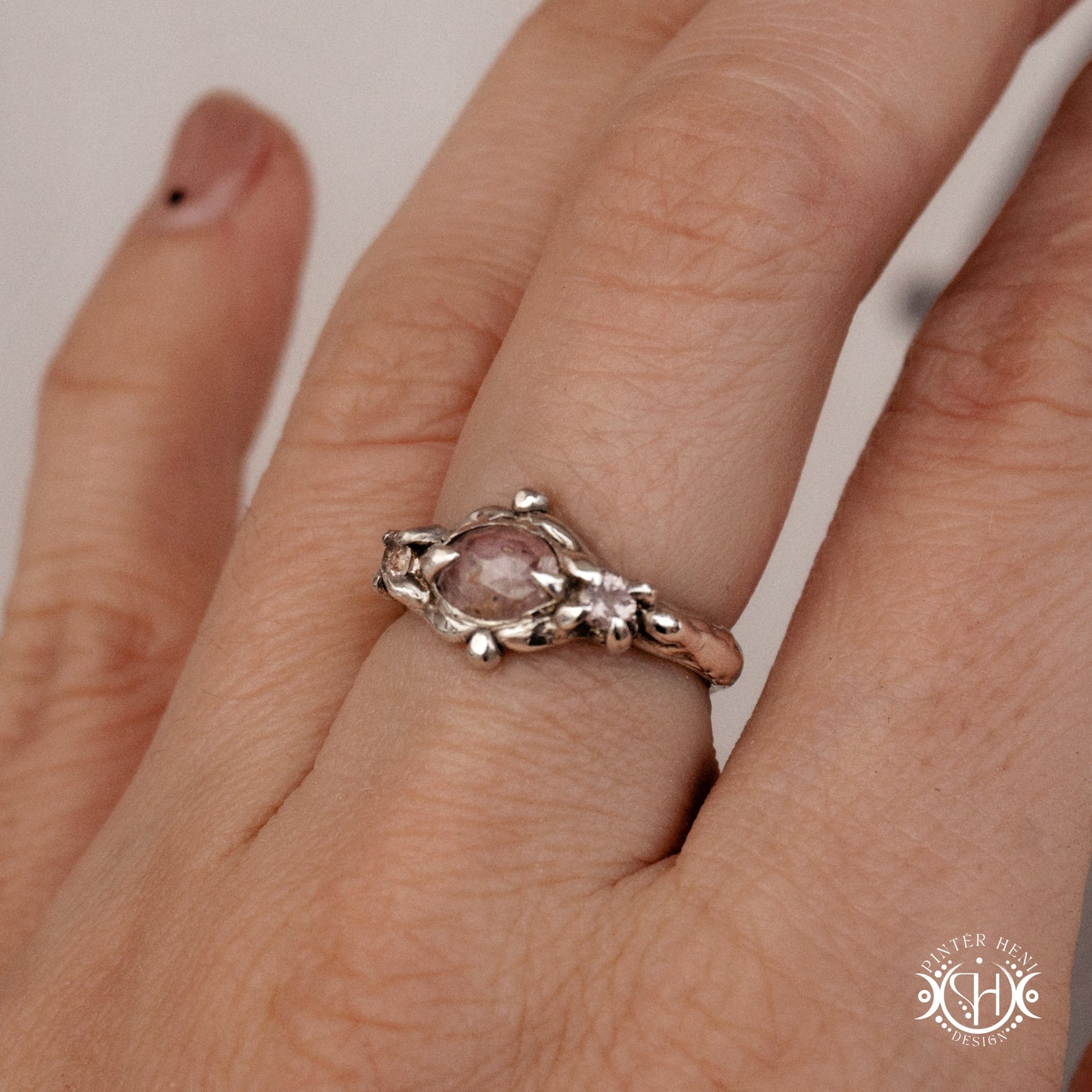 Sterling silver organic ring with pink Burma spinel and pink tourmaline in sculptural setting.