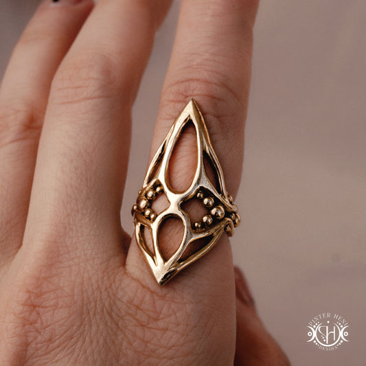 Pulse Ring sculptural axial handmade ring with compact vertical organic form in brass, on hand.