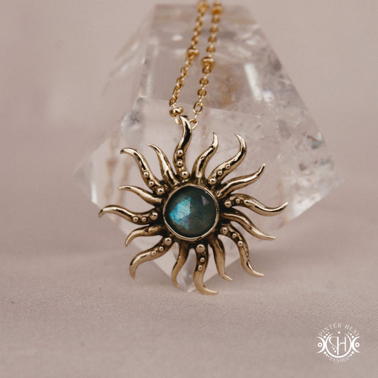 Hand-carved sun pendant in brass with organic rays from the Primal Symbols collection