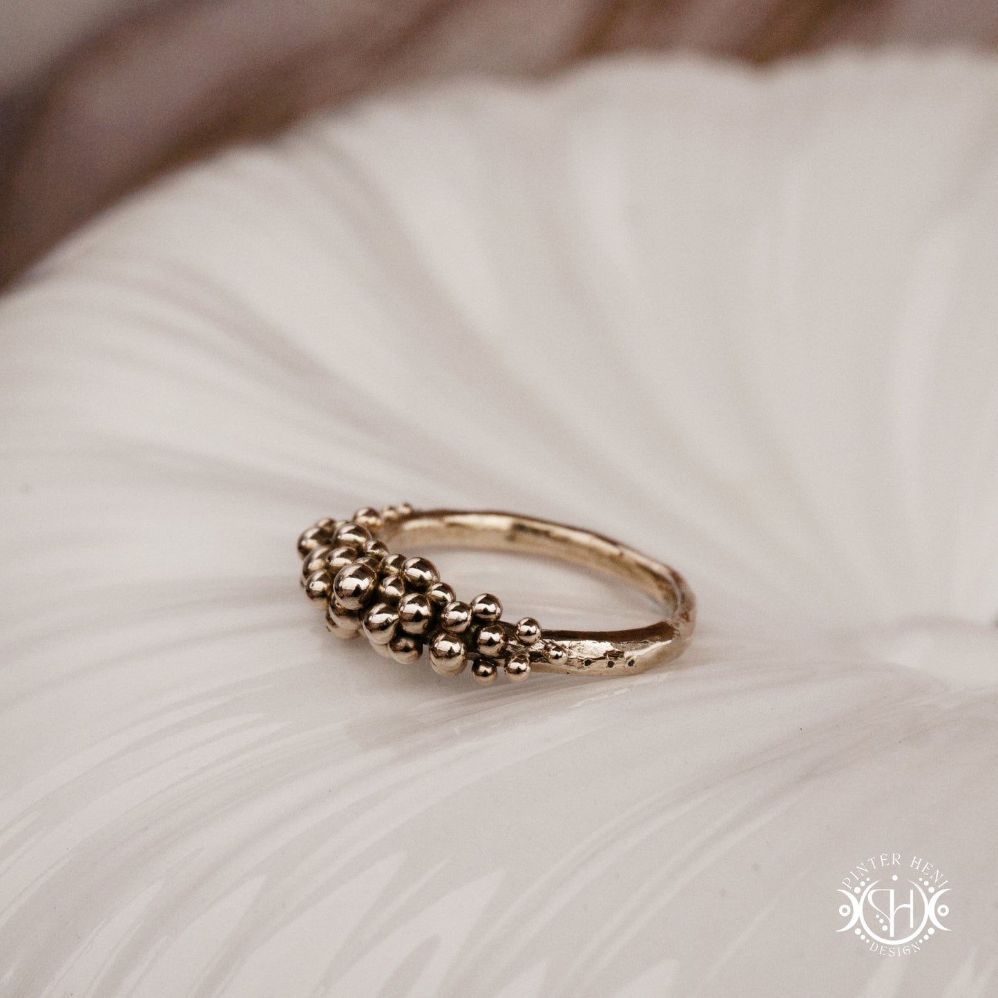 Supernova Ring with clustered bead texture forming an upper arc in handcrafted metal