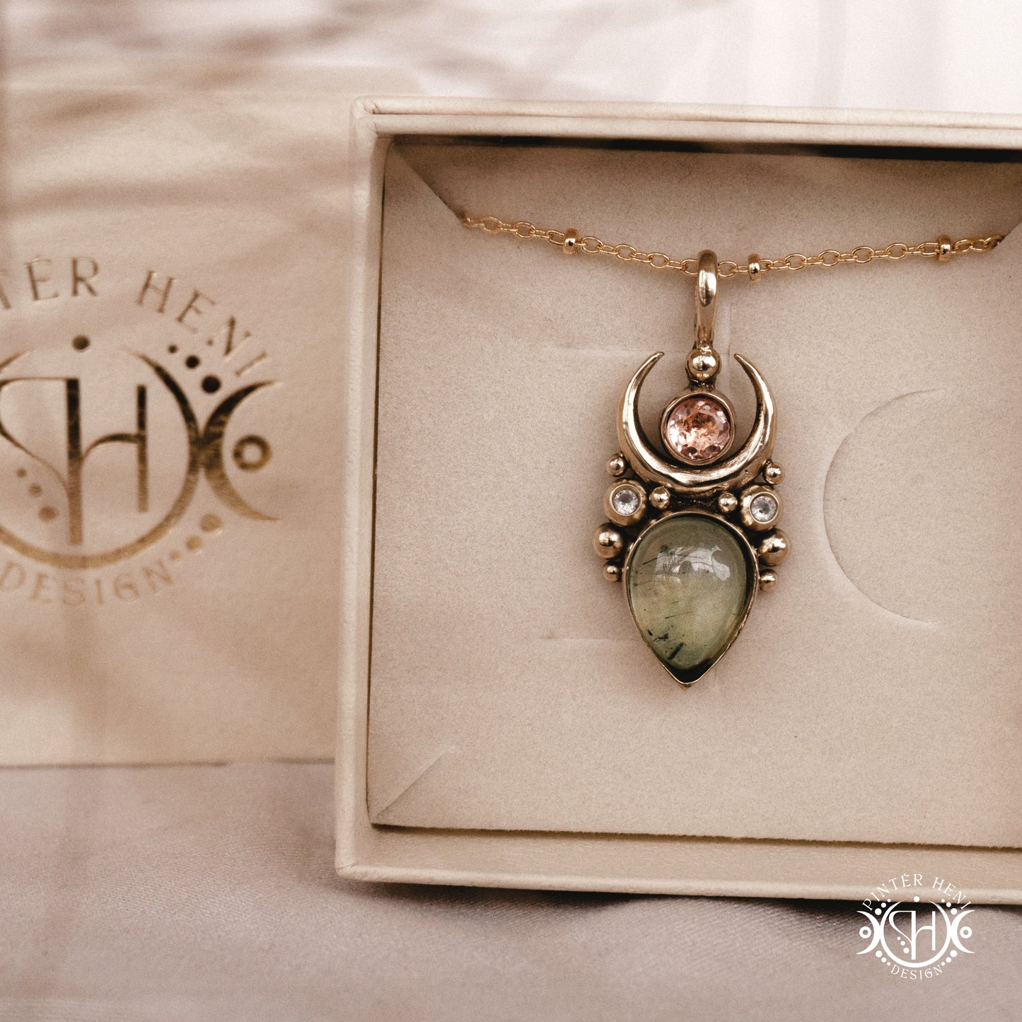 Handmade Artemis pendant with green prehnite and morganite in brass setting, in a branded jewelry box. Available in brass, silver, and solid gold.