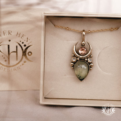 Handmade Artemis pendant with green prehnite and morganite in brass setting, in a branded jewelry box. Available in brass, silver, and solid gold.