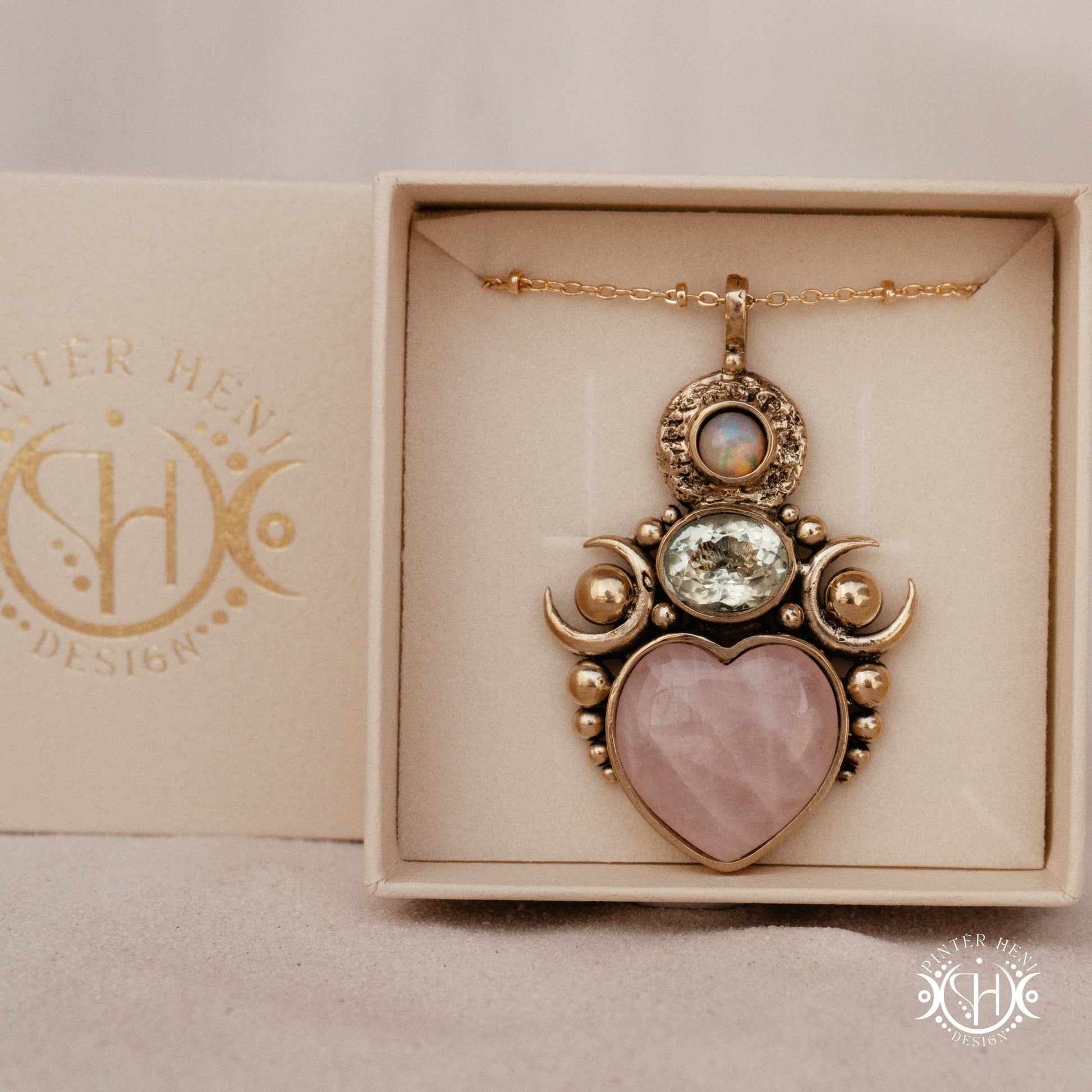 Hand-carved Aphrodite pendant with rose quartz, opal and prasiolite.