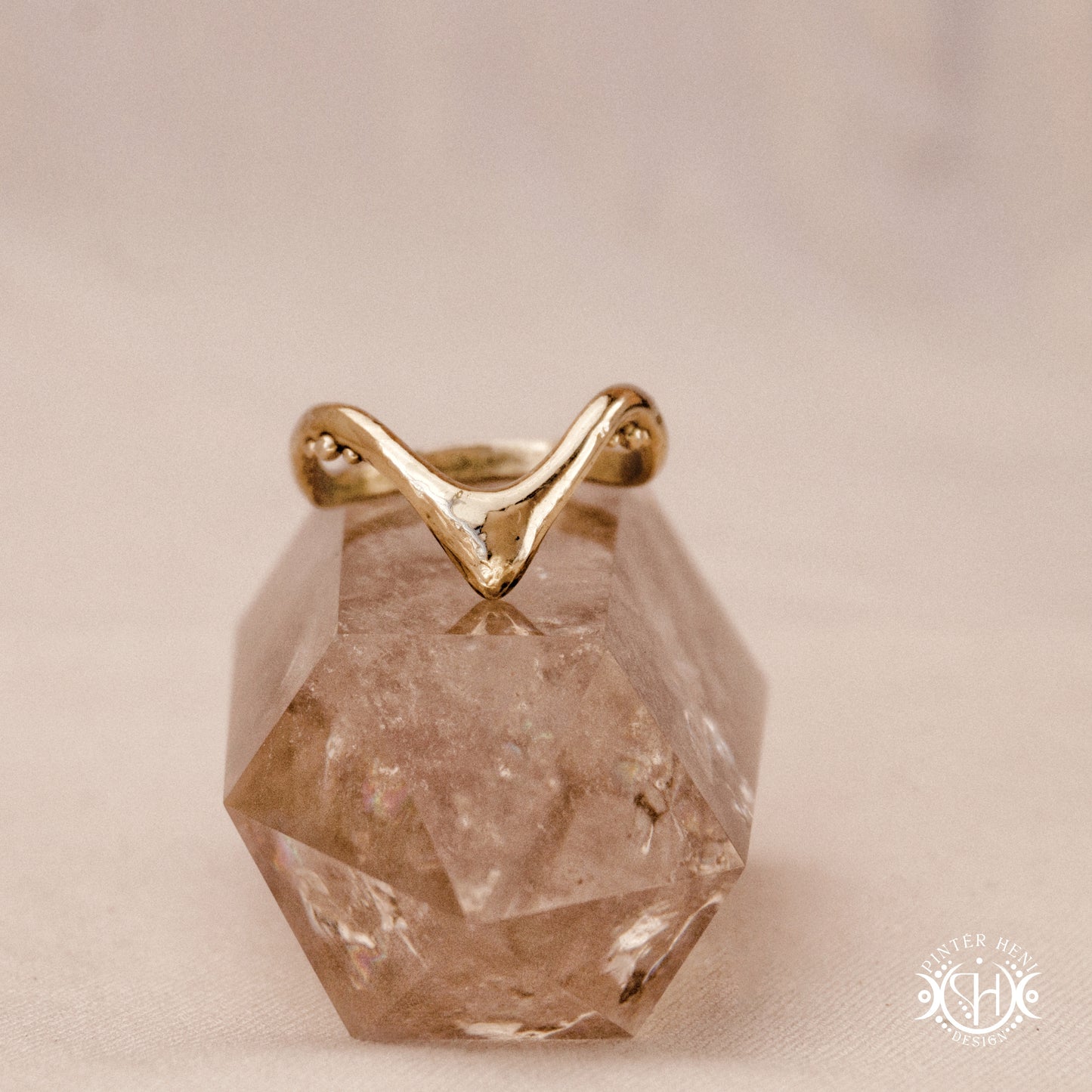 Arc Ring organic sculptural wave ring handmade in brass with rounded nodular details.