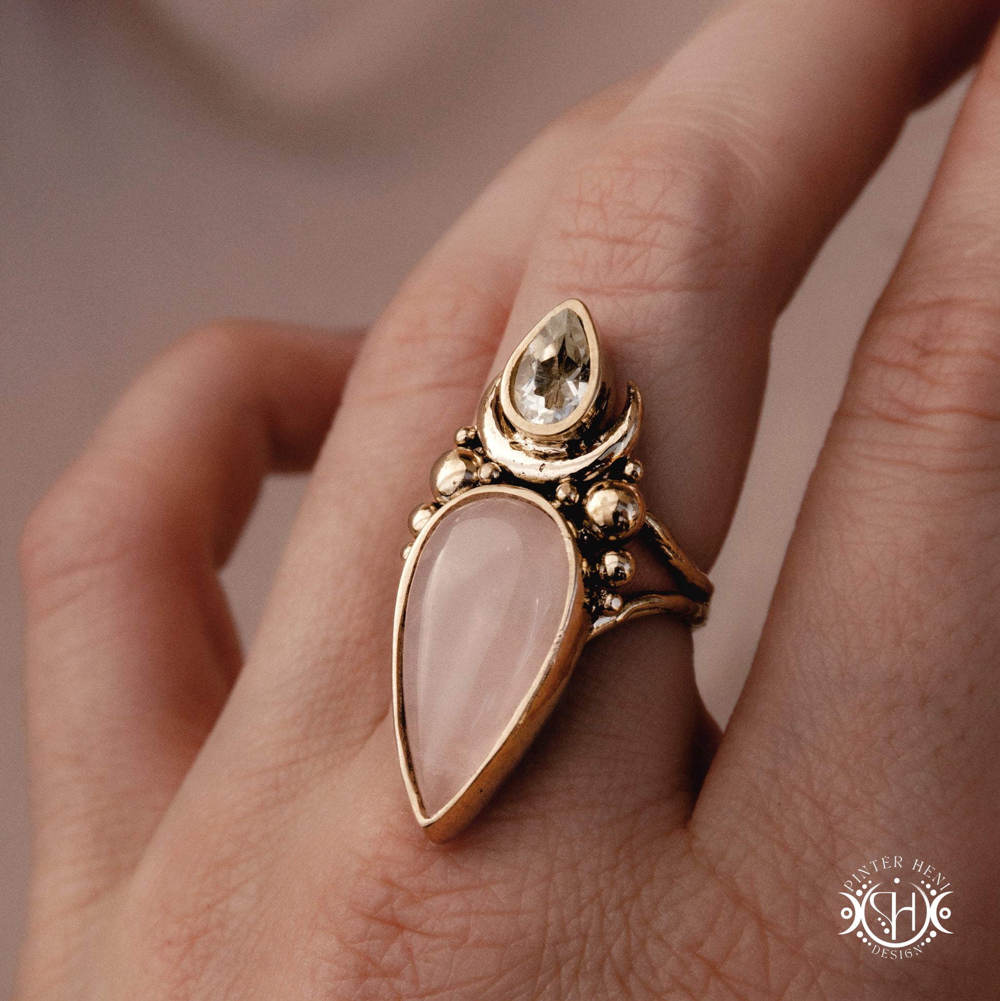 Handmade Artemis ring with prasiolite and rose quartz, worn on hand.