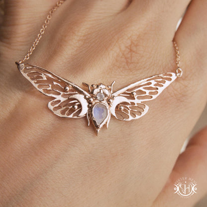 Handcrafted cicada pendant with moonstone in rose gold.