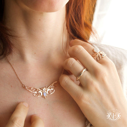 Handcrafted cicada pendant with moonstone in rose gold.