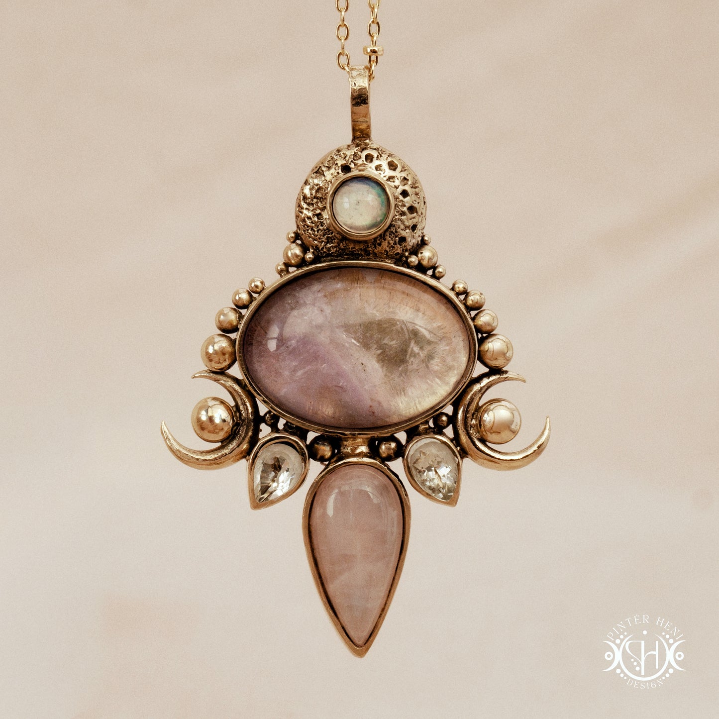 Hand-carved Demeter pendant with rose quartz, amethyst and prasiolite.