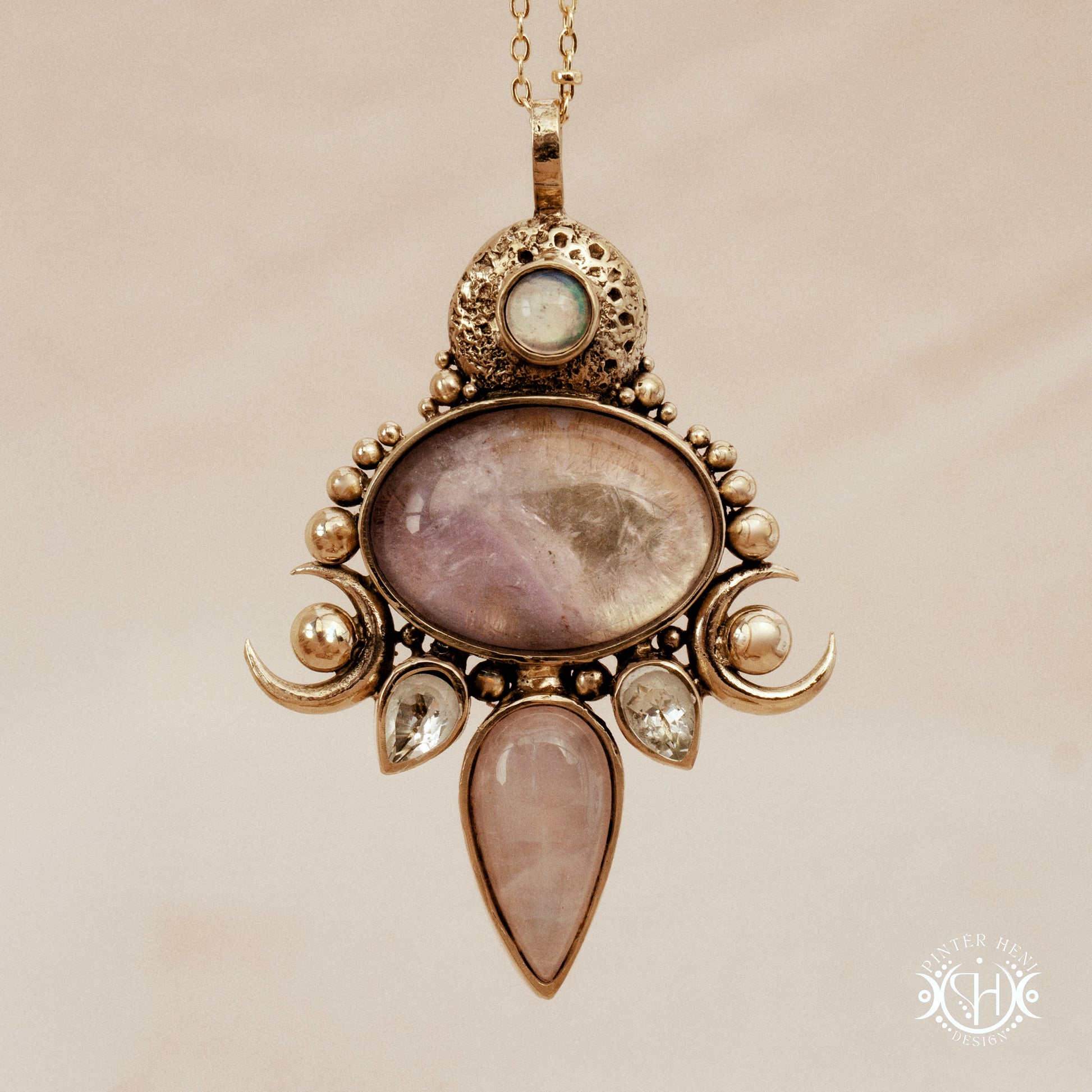 Hand-carved Demeter pendant with rose quartz, amethyst and prasiolite.