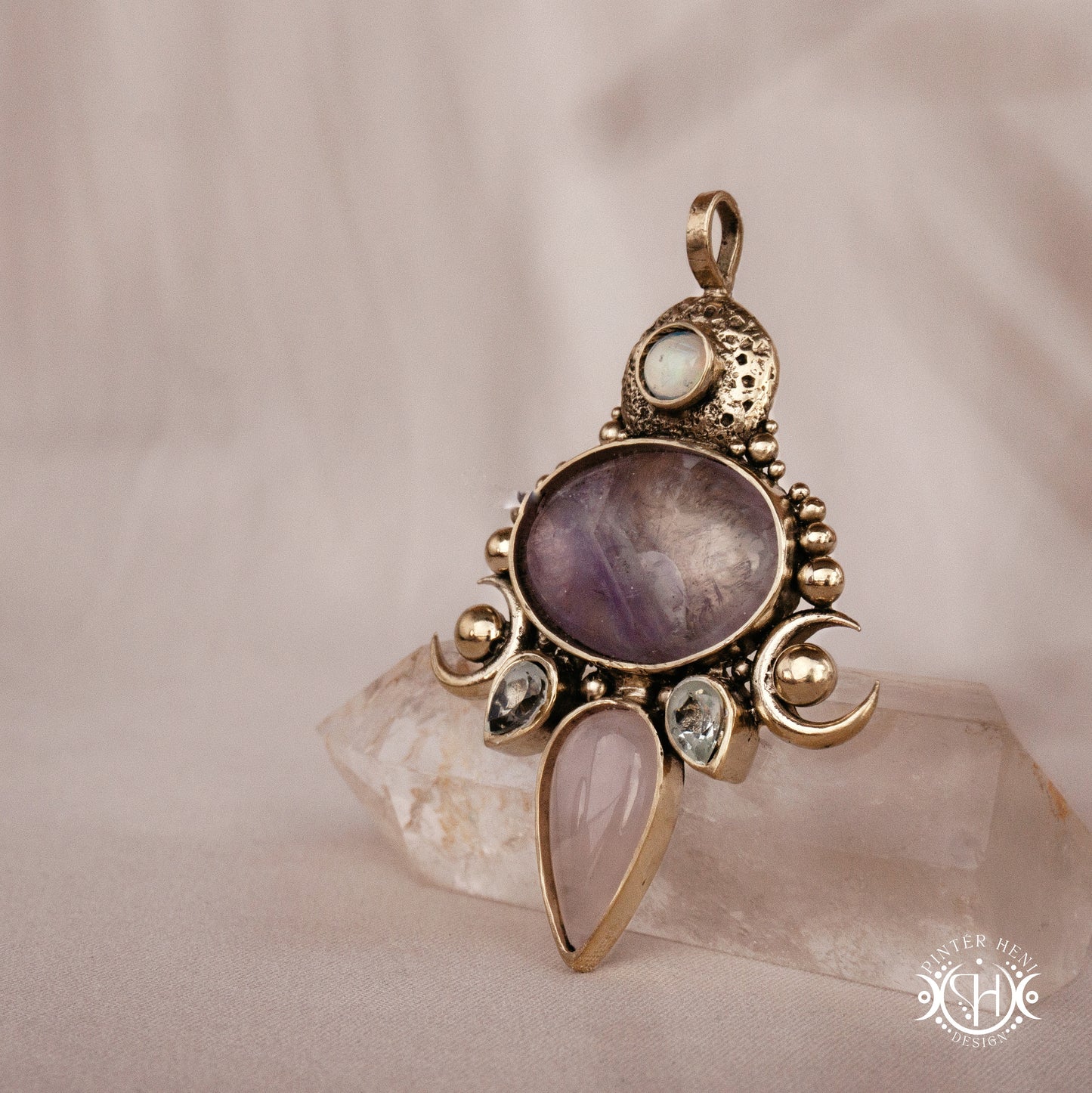 Hand-carved Demeter pendant with rose quartz, amethyst and prasiolite.