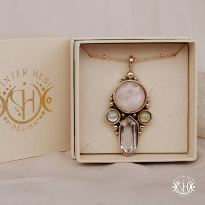 Brass pendant with rose quartz, clear quartz and opal stones, in branded jewelry box.
