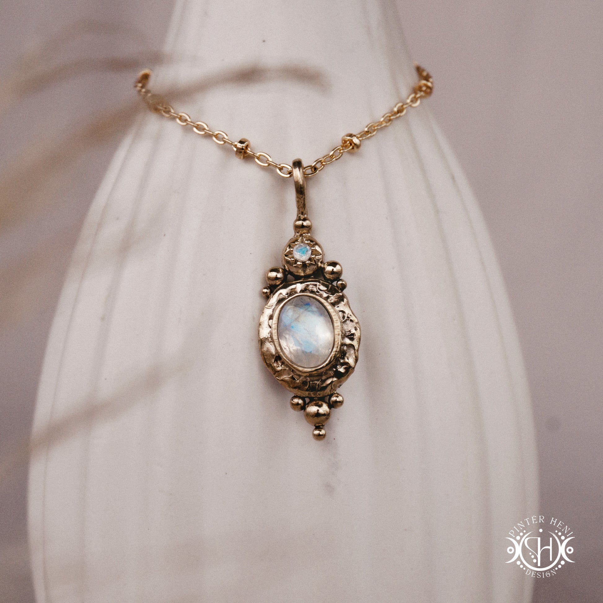 Handmade organic pendant with moonstone and compact ancient-inspired form. Made to order in brass, silver or gold.