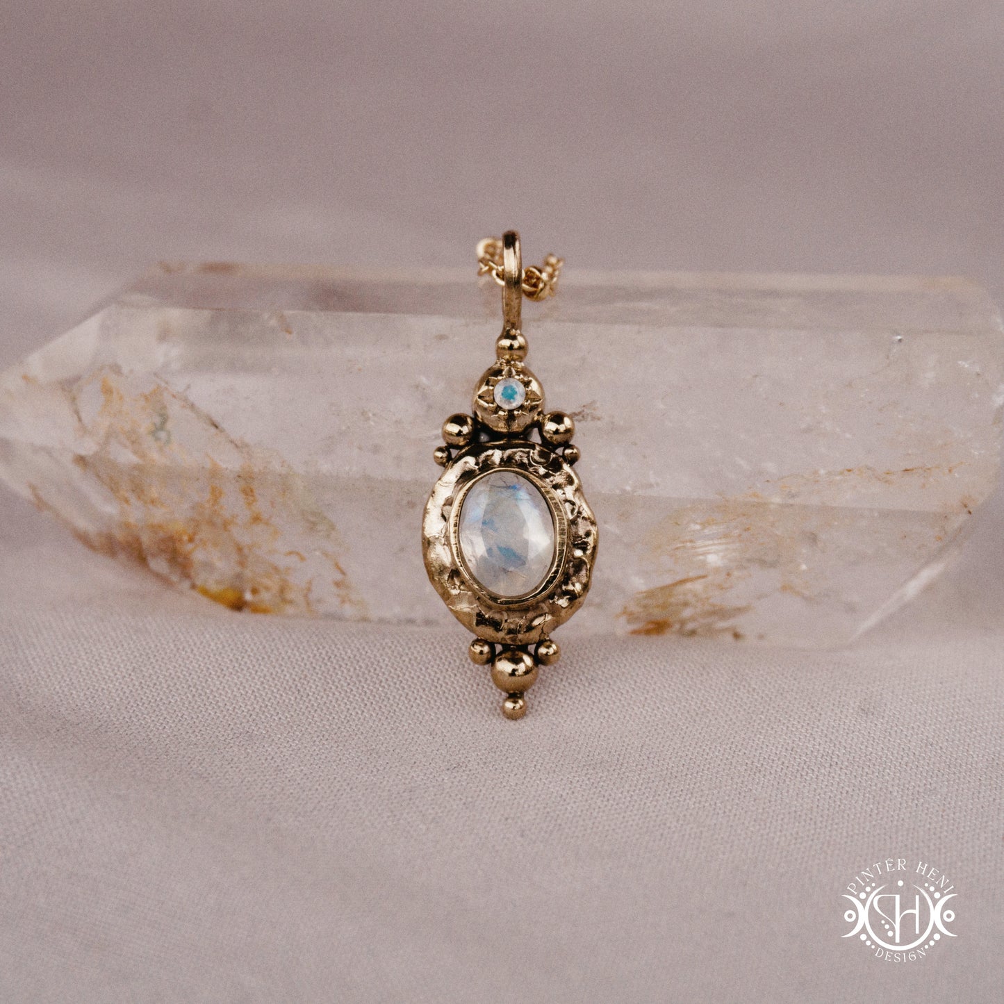 Handmade organic pendant with moonstone and compact ancient-inspired form. Made to order in brass, silver or gold.