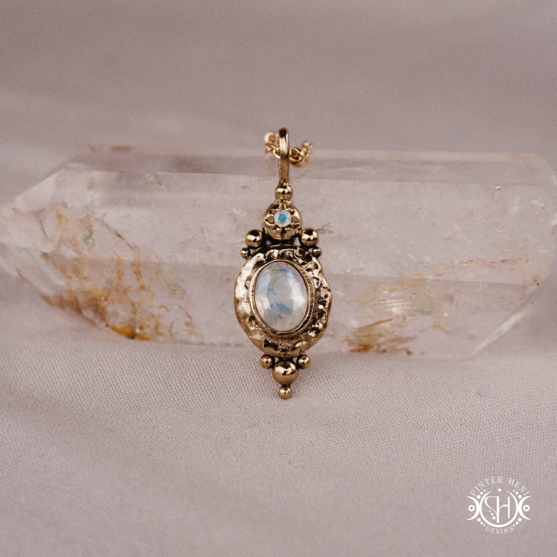 Handmade organic pendant with moonstone and compact ancient-inspired form. Made to order in brass, silver or gold.