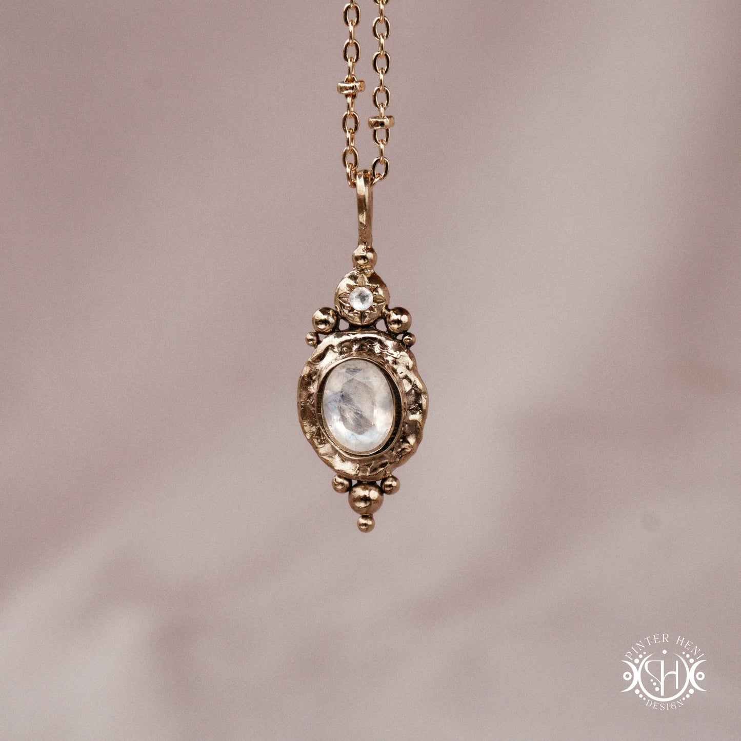 Handmade organic pendant with moonstone and compact ancient-inspired form. Made to order in brass, silver or gold.