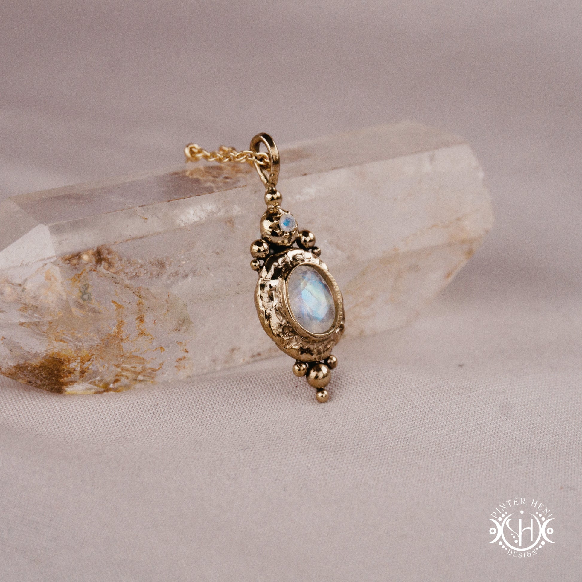 Handmade organic pendant with moonstone and compact ancient-inspired form. Made to order in brass, silver or gold.