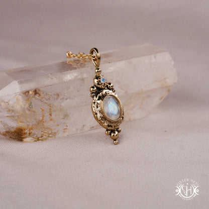 Handmade organic pendant with moonstone and compact ancient-inspired form. Made to order in brass, silver or gold.