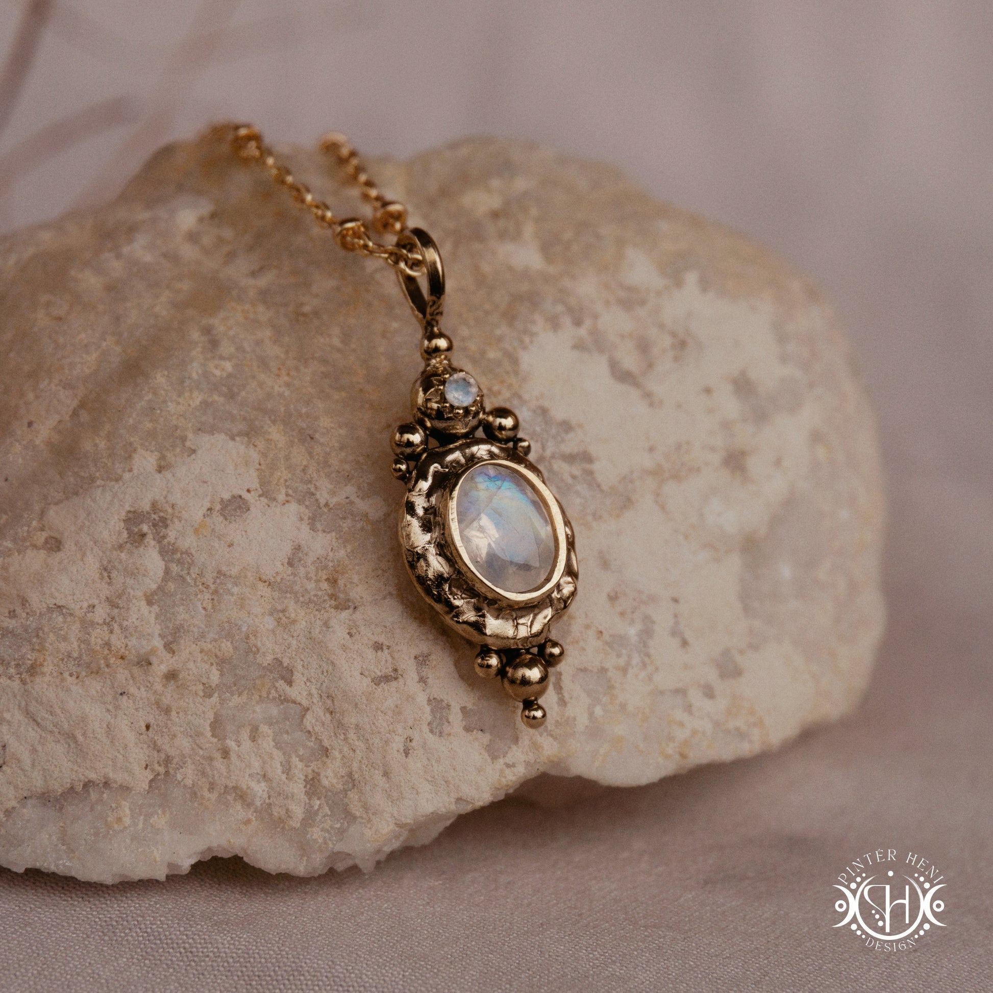 Handmade organic pendant with moonstone and compact ancient-inspired form. Made to order in brass, silver or gold.