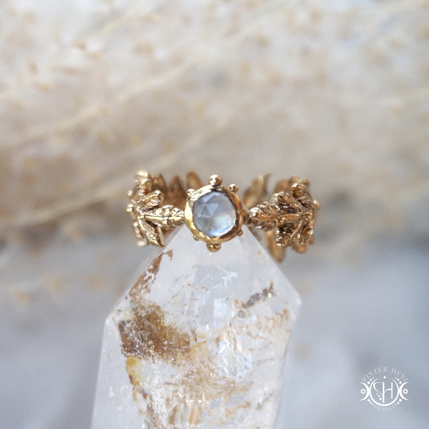 Handcrafted small fern ring with moonstone in brass setting.