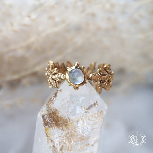 Handcrafted small fern ring with moonstone in brass setting.