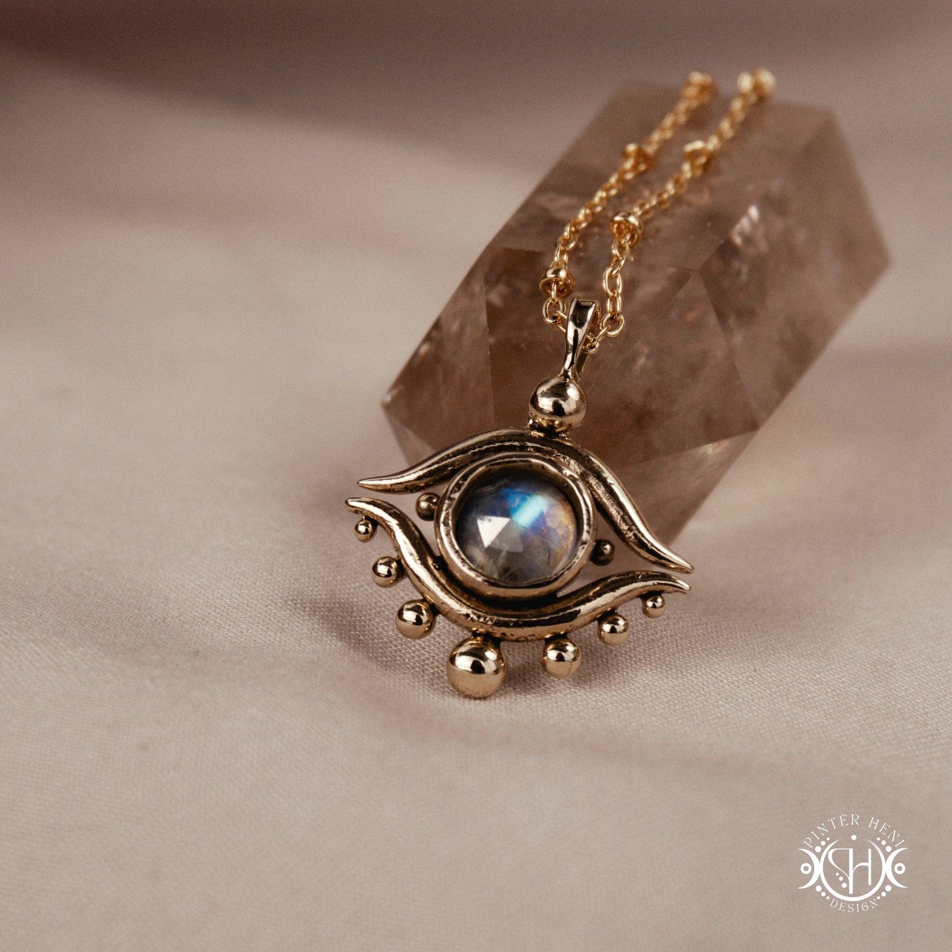 Hand-carved eye pendant in brass from the Primal Symbols collection by Pintér Heni Design
