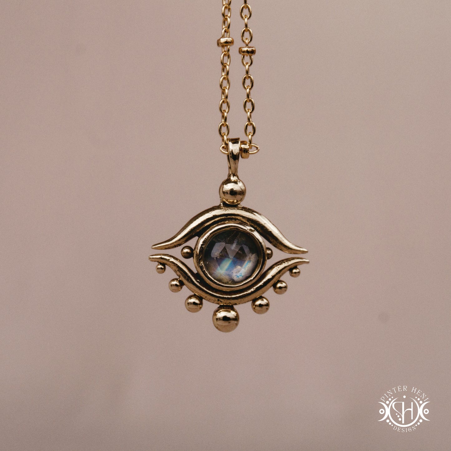 Hand-carved eye pendant in brass from the Primal Symbols collection by Pintér Heni Design, front view