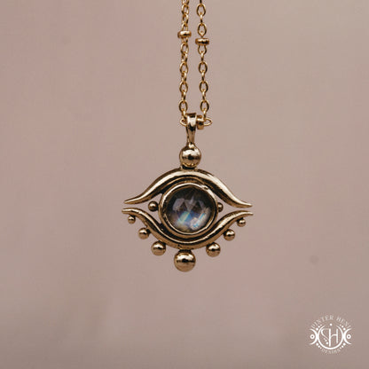 Hand-carved eye pendant in brass from the Primal Symbols collection by Pintér Heni Design, front view