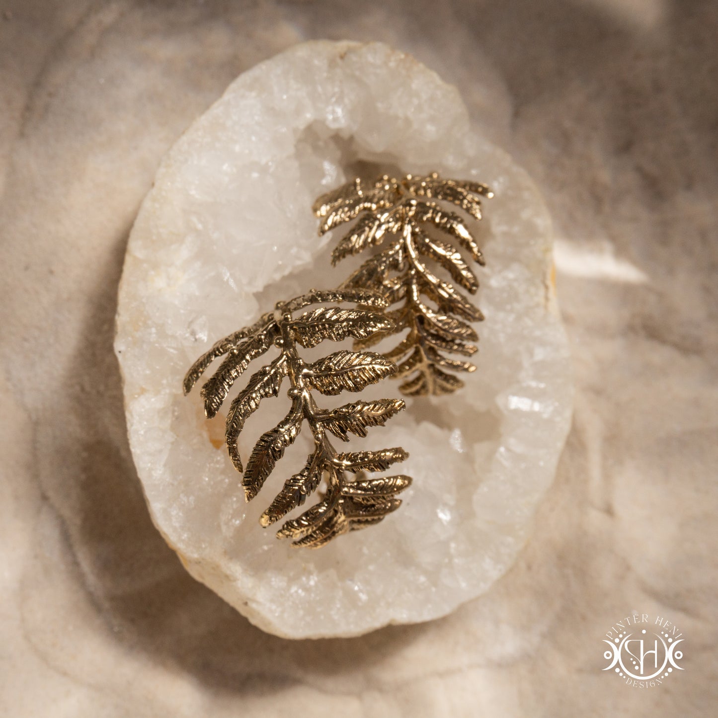 Small handcrafted fern earrings with moonstone in brass.