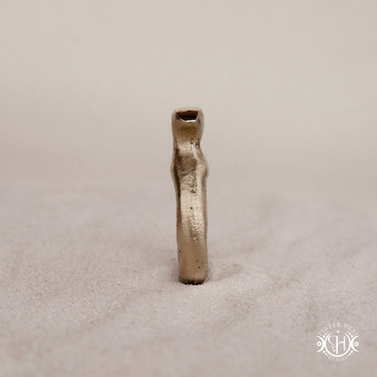 Glyph Ring handmade sandcast brass ring with curved sculptural top and ancient symbolic character