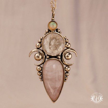 Hand-carved Hecate pendant with rose quartz, rock crystal and opal.