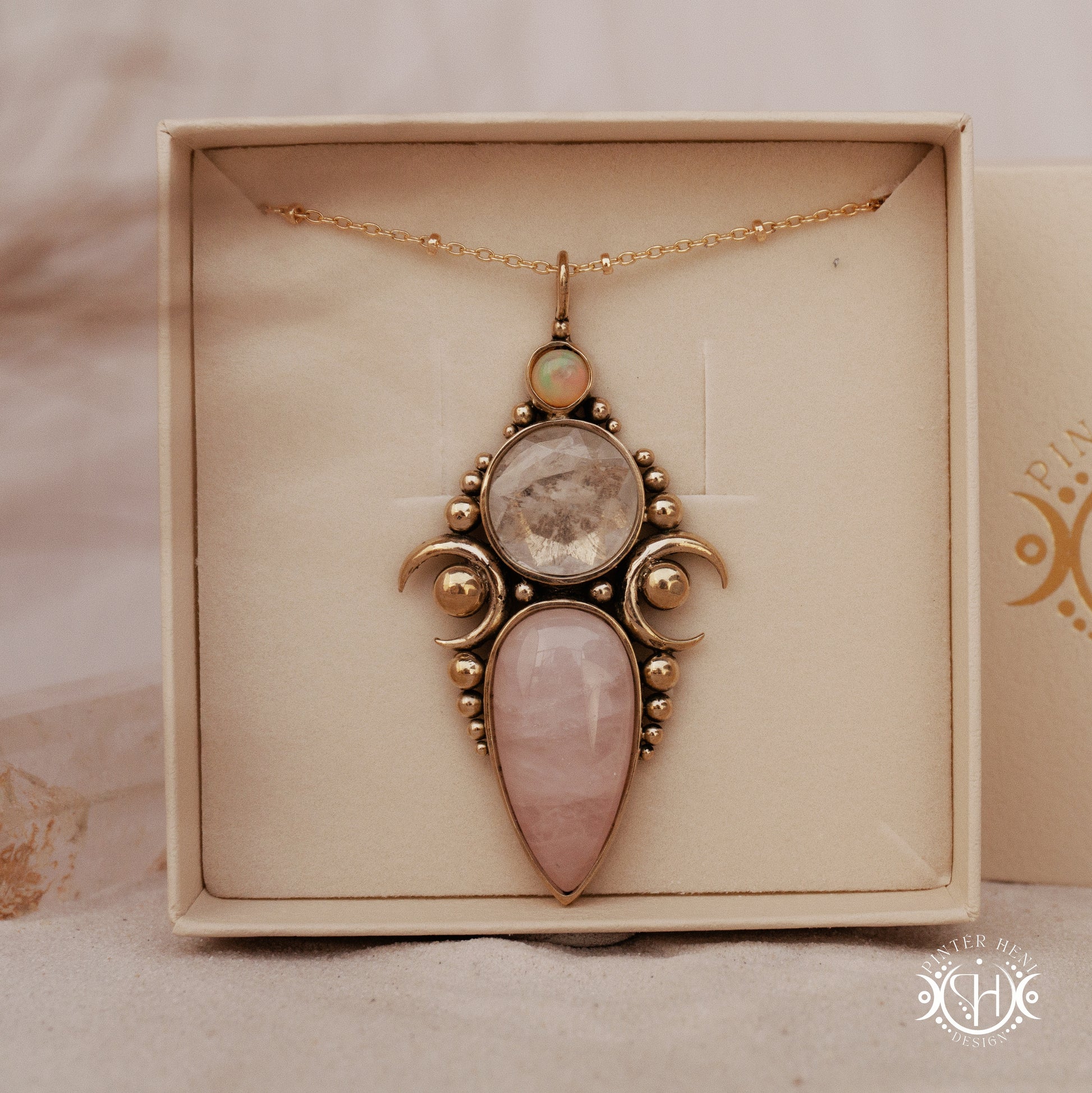 Hand-carved Hecate pendant with rose quartz, rock crystal and opal.