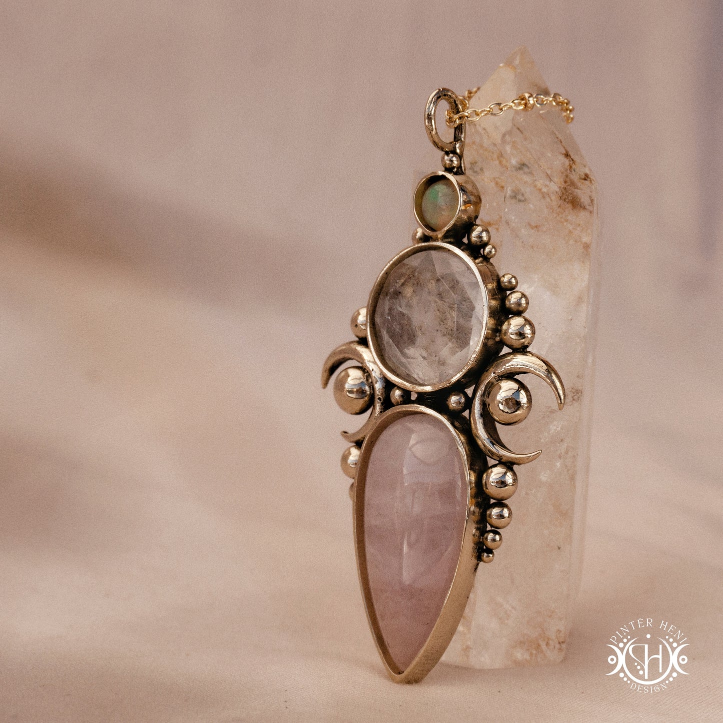 Hand-carved Hecate pendant with rose quartz, rock crystal and opal.