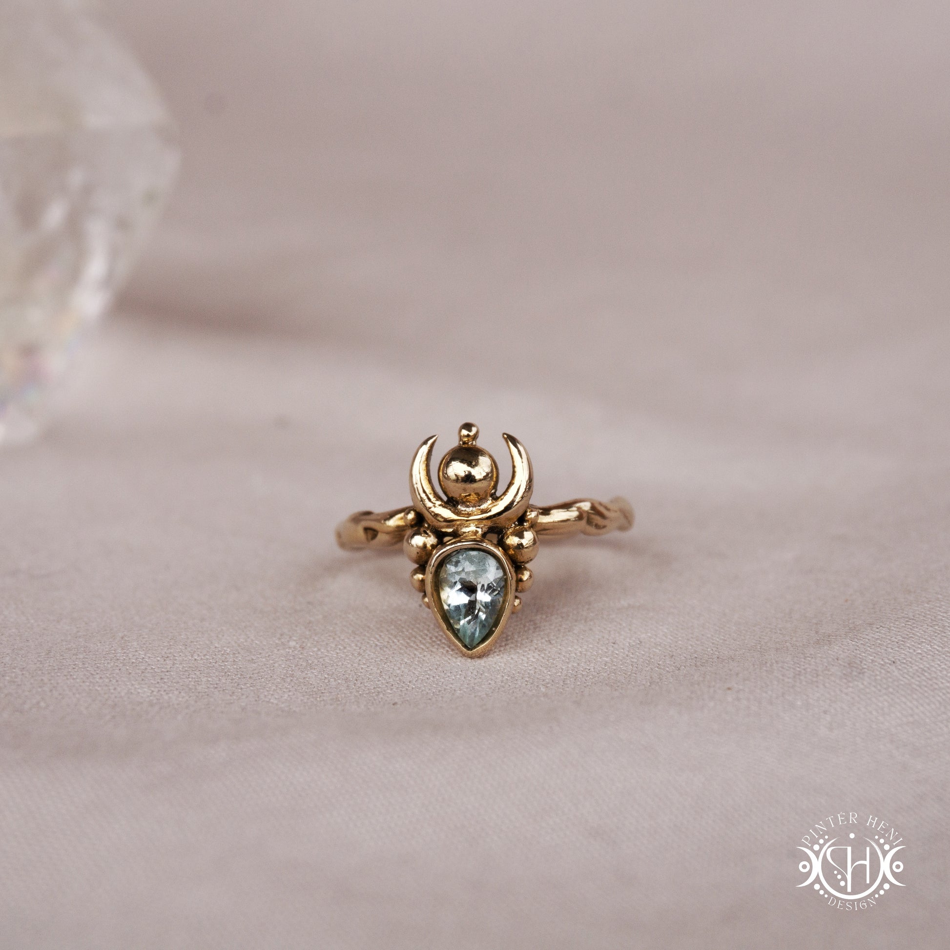 Handmade small scale Hecate ring with garnet in sculptural feminine design