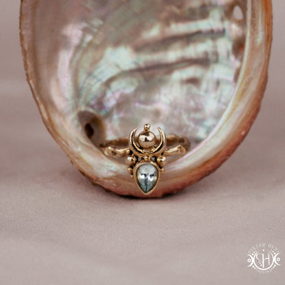 Handmade small scale Hecate ring with aquamarine in sculptural feminine design, in a shell