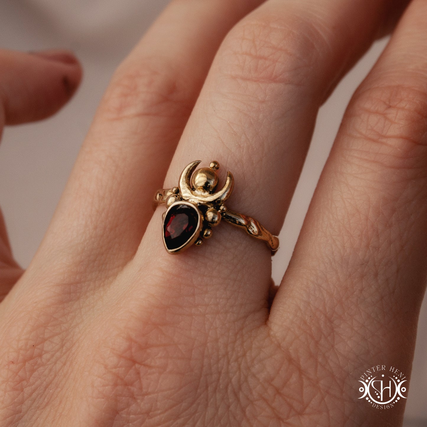 Handmade small scale Hecate ring with aquamarine in sculptural feminine design, on hand.