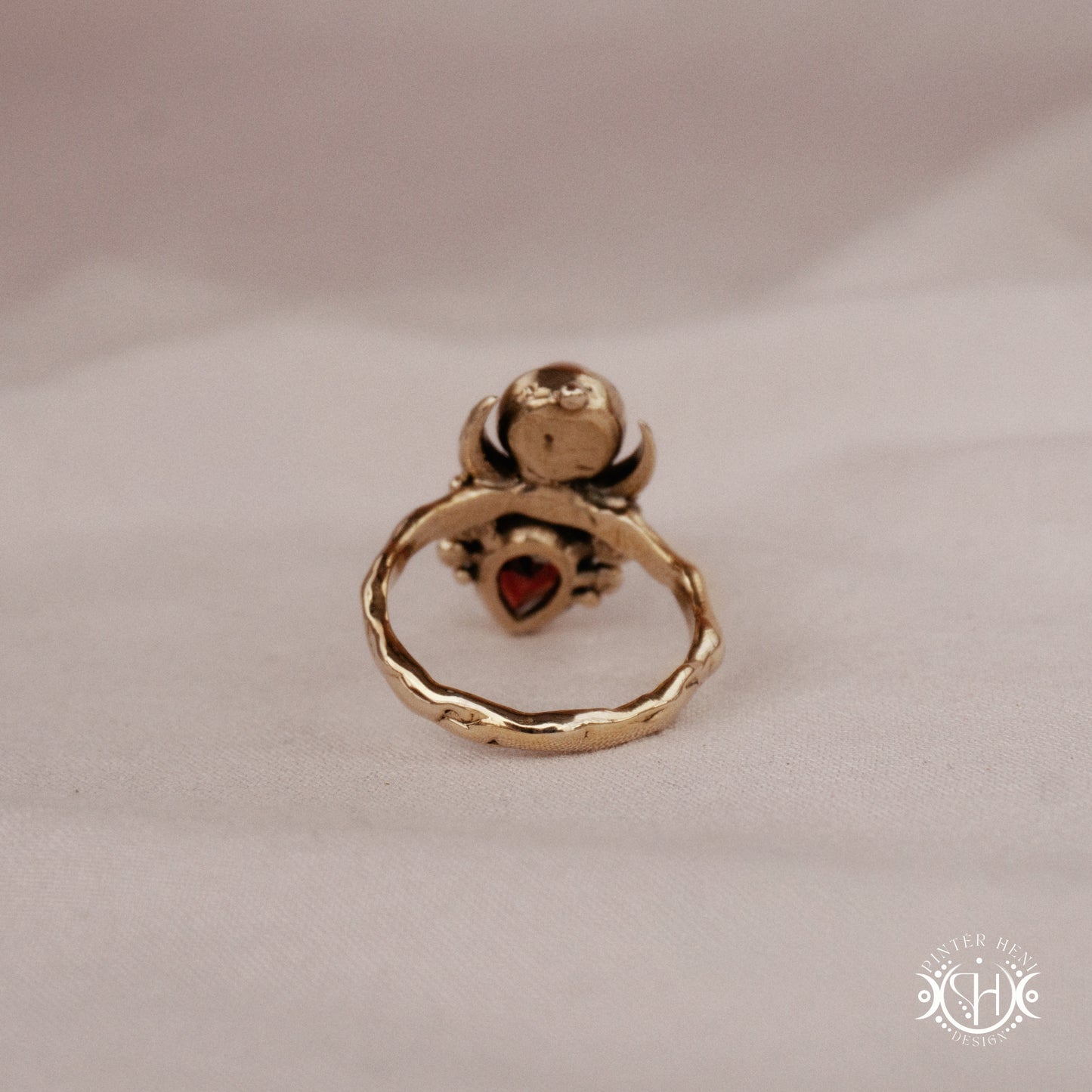 Handmade Hecate ring with garnet and pearl in sculptural feminine design