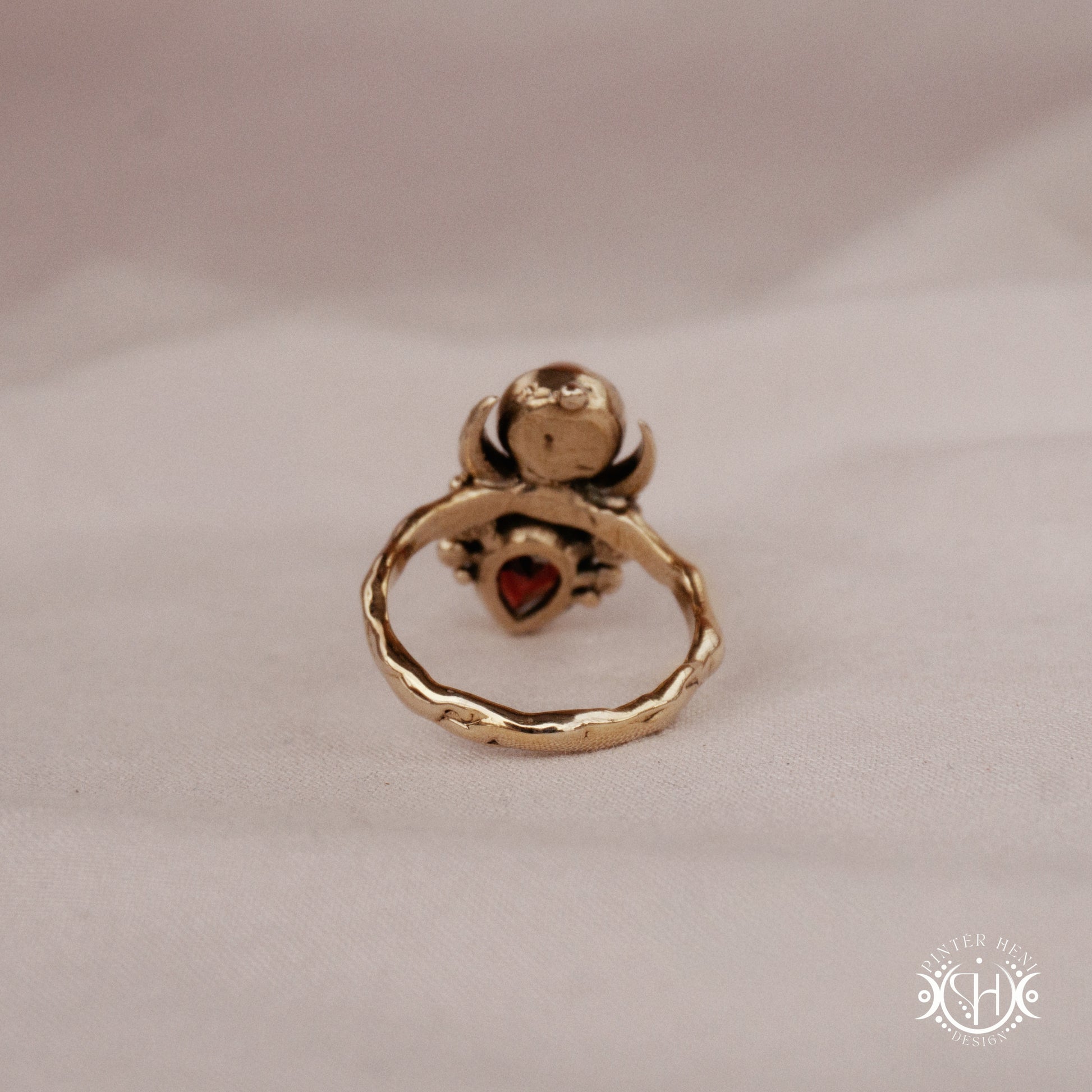 Handmade Hecate ring with garnet and pearl in sculptural feminine design
