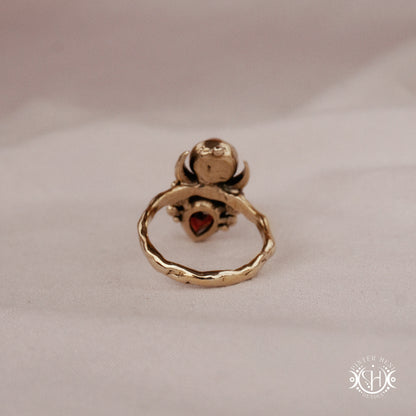 Handmade Hecate ring with garnet and pearl in sculptural feminine design