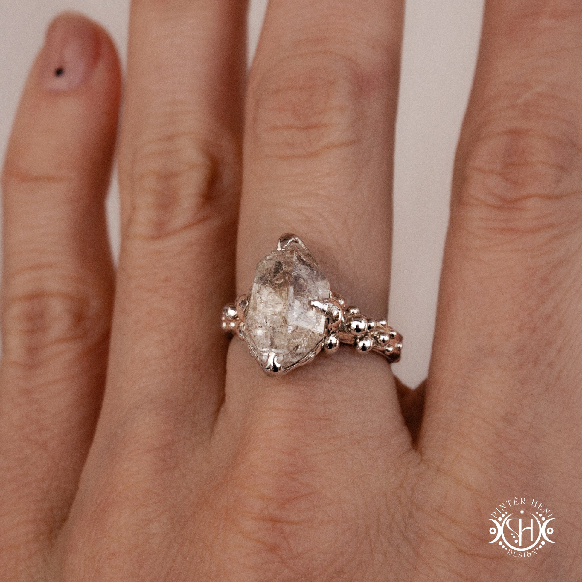 One-of-a-kind sterling silver ring featuring a raw Herkimer diamond. Organic sculptural design with natural crystal texture.
