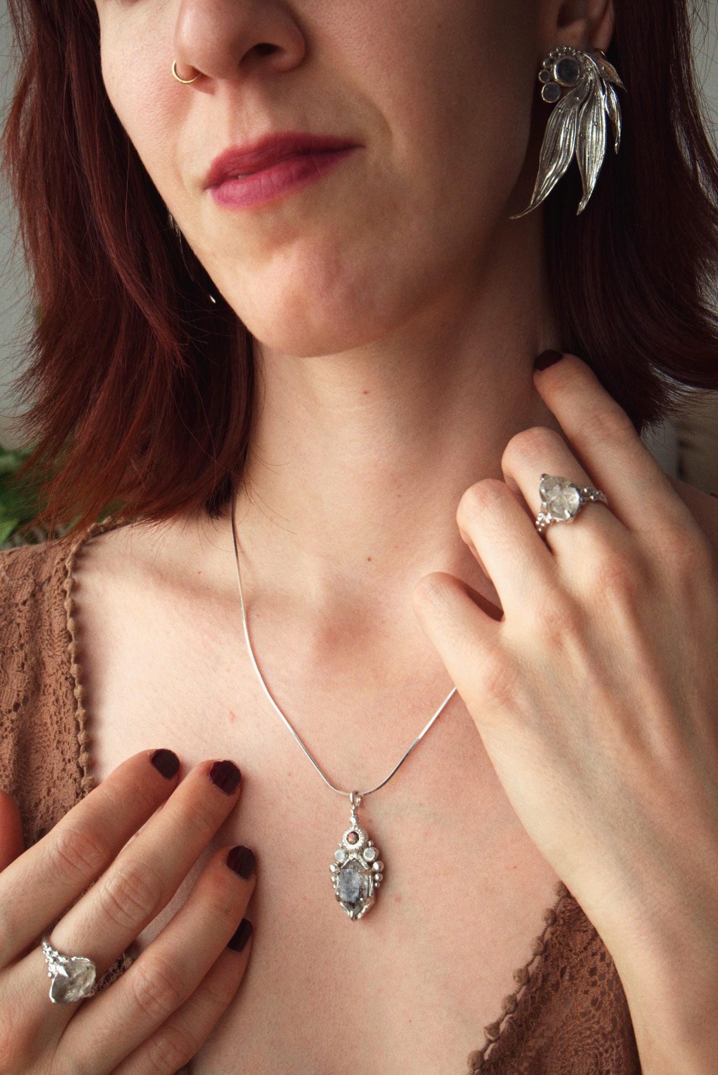 One-of-a-kind sterling silver ring featuring a raw Herkimer diamond. Organic sculptural design with natural crystal texture.