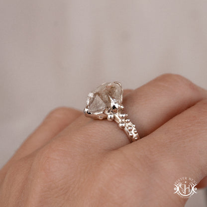 One-of-a-kind sterling silver ring featuring a raw Herkimer diamond. Organic sculptural design with natural crystal texture.