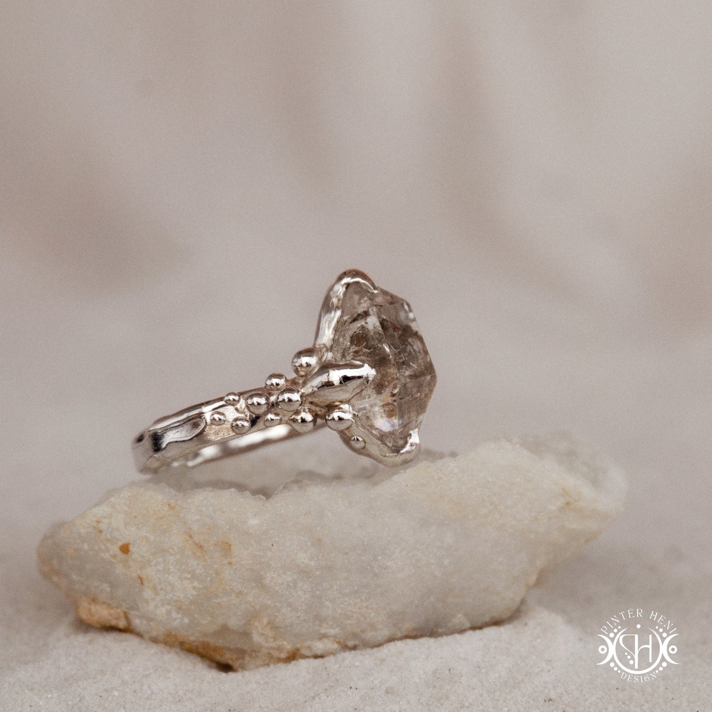 One-of-a-kind sterling silver ring featuring a raw Herkimer diamond. Organic sculptural design with natural crystal texture.