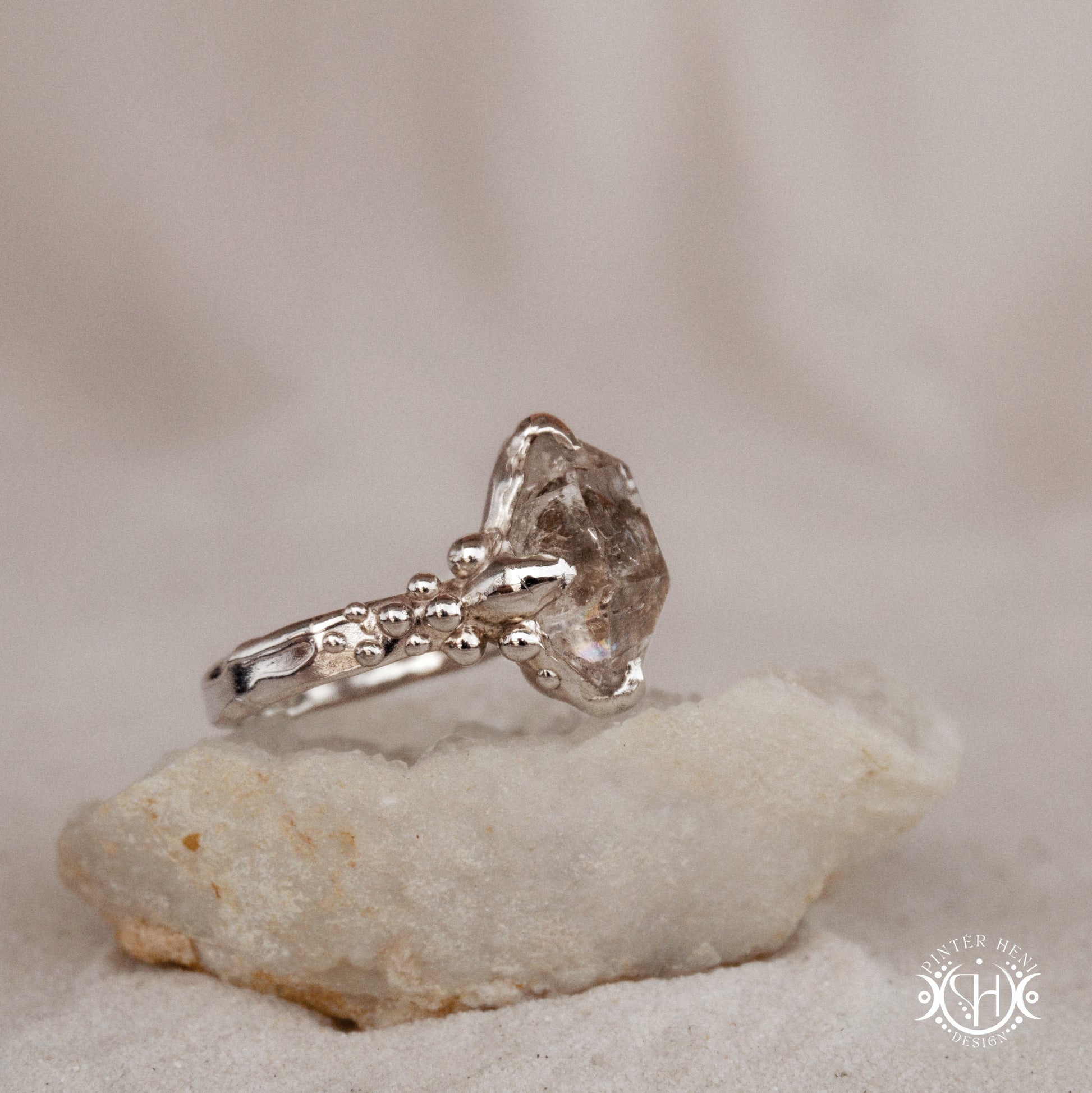 One-of-a-kind sterling silver ring featuring a raw Herkimer diamond. Organic sculptural design with natural crystal texture.