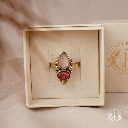 Handmade Hestia ring with rose quartz and garnet in balanced sculptural setting, in branded jewerlry box
