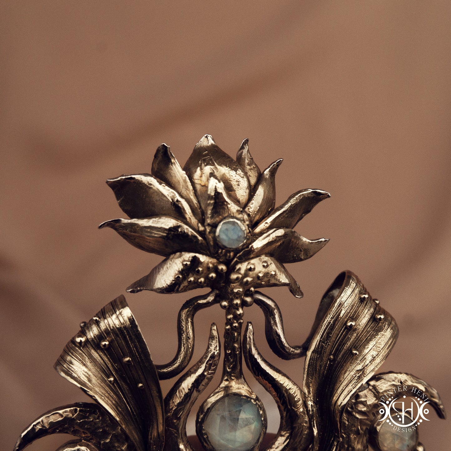 Large brass statement pendant with crystals and gemstones arranged in a crown-like sculptural form, Ishtar’s Oasis necklace.