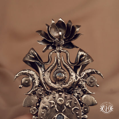 Large brass statement pendant with crystals and gemstones arranged in a crown-like sculptural form, Ishtar’s Oasis necklace.