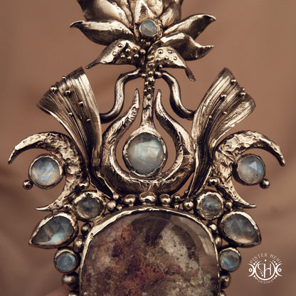 Large brass statement pendant with crystals and gemstones arranged in a crown-like sculptural form, Ishtar’s Oasis necklace.